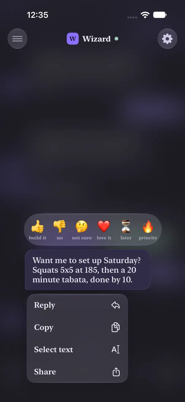 Holding an agent bubble in dark mode: the six reactions above it and Reply, Copy, Select text, Share below.