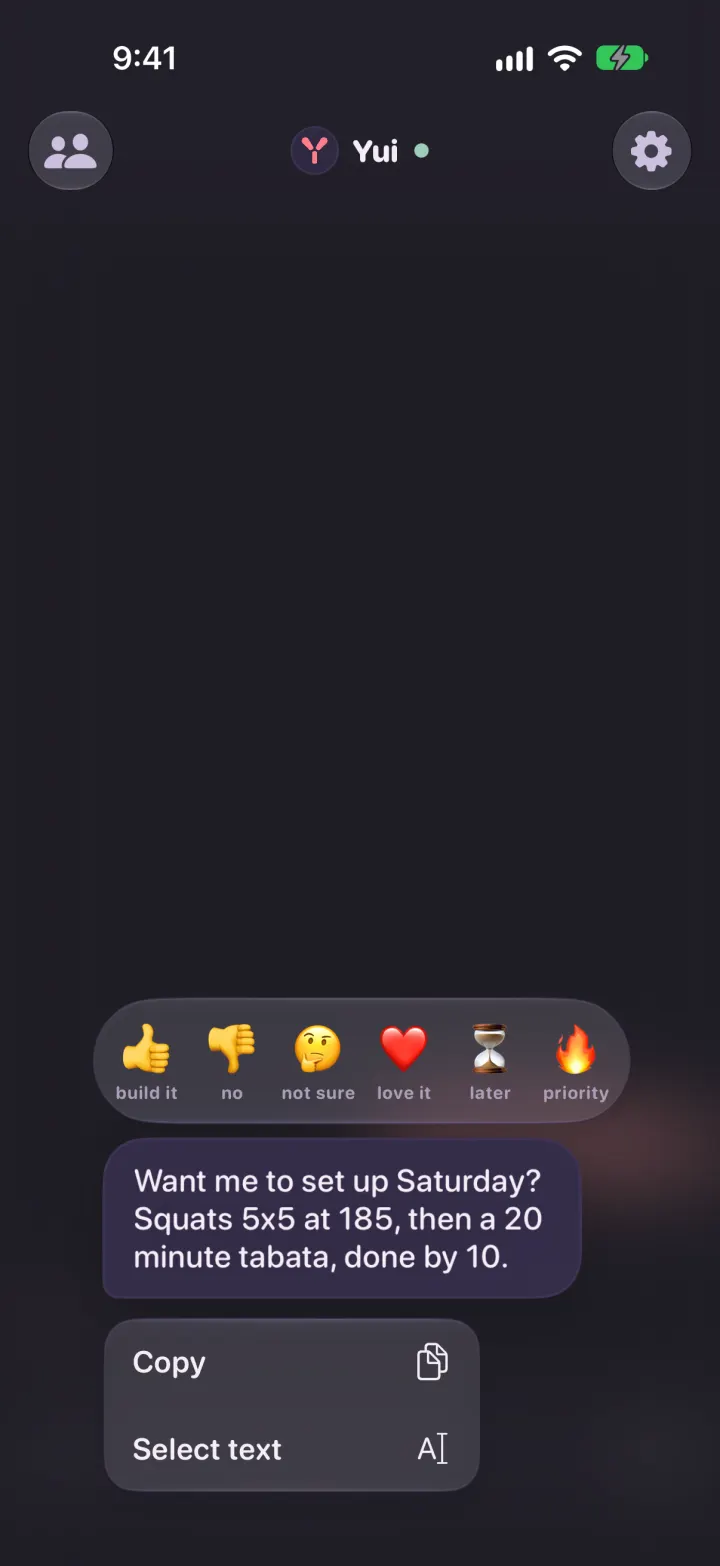 A held message in dark mode, with the six reactions above it and Copy and Select text below it