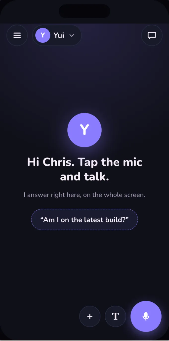 Dark mode: the full screen stage waiting, Yui's face in the middle, settings and Yui top left, the chat button top right, plus, T and a big mic bottom right.