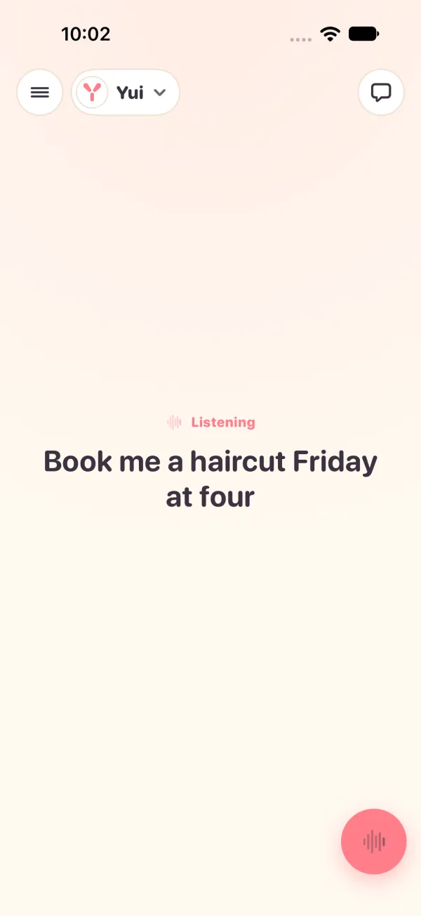 Light mode: talking. Listening, and the words Book me a haircut Friday at four stream in large, with only the mic left in the corner.