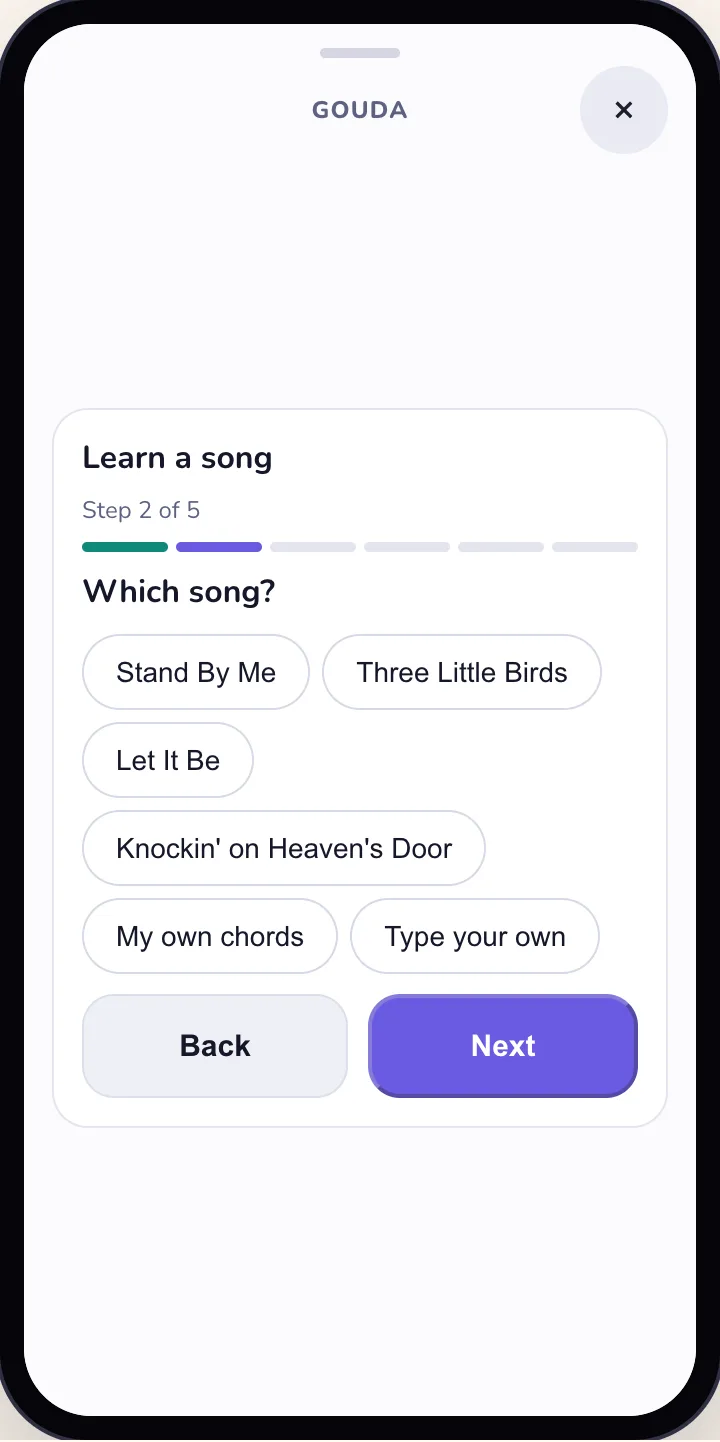 Learn a song, step 2 of 5: Which song? Stand By Me, Three Little Birds, Let It Be, Knockin' on Heaven's Door, or your own chords