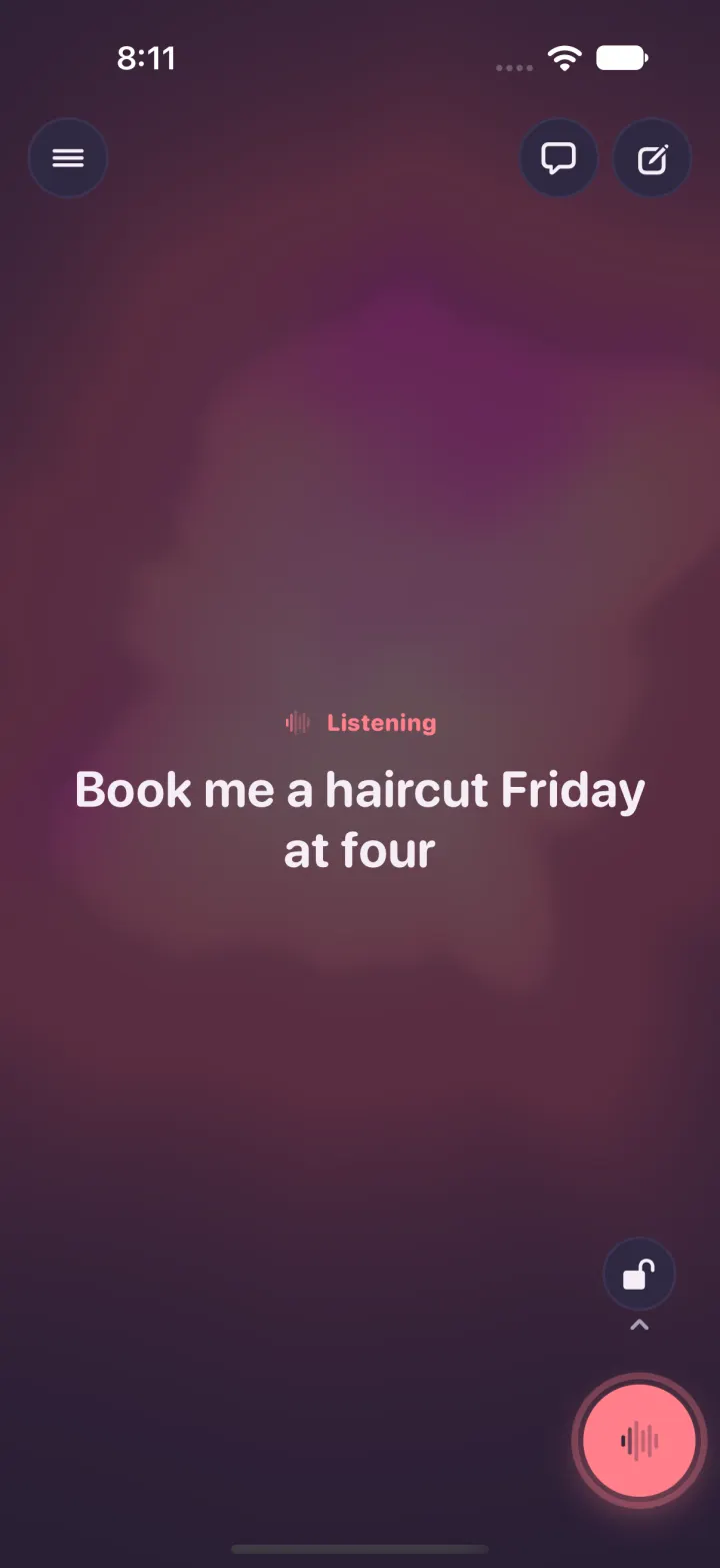 Dark mode: the listening screen with the words heard so far, and a small open lock with an up arrow just above the round mic button, bottom right.