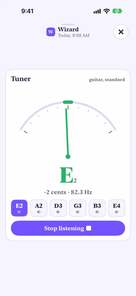 The tuner open on guitar, standard tuning: the needle reads E2, minus 2 cents, with the six strings under it and Stop listening
