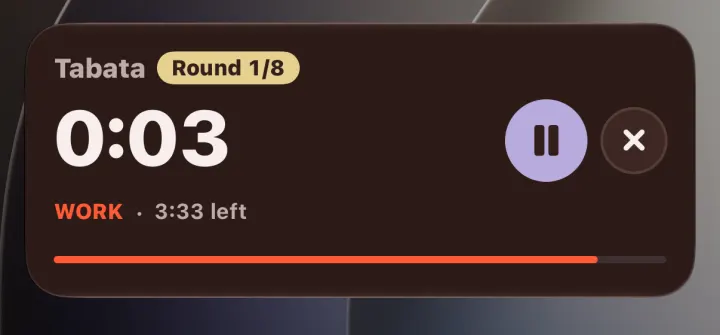 The lock screen with a Tabata timer card: round 1 of 8, 3 seconds left in the work phase, 3:33 left in the workout, a pause button and an end button