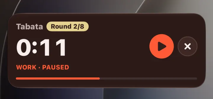 The same card paused in round 2 of 8 at 11 seconds, with a play button to resume
