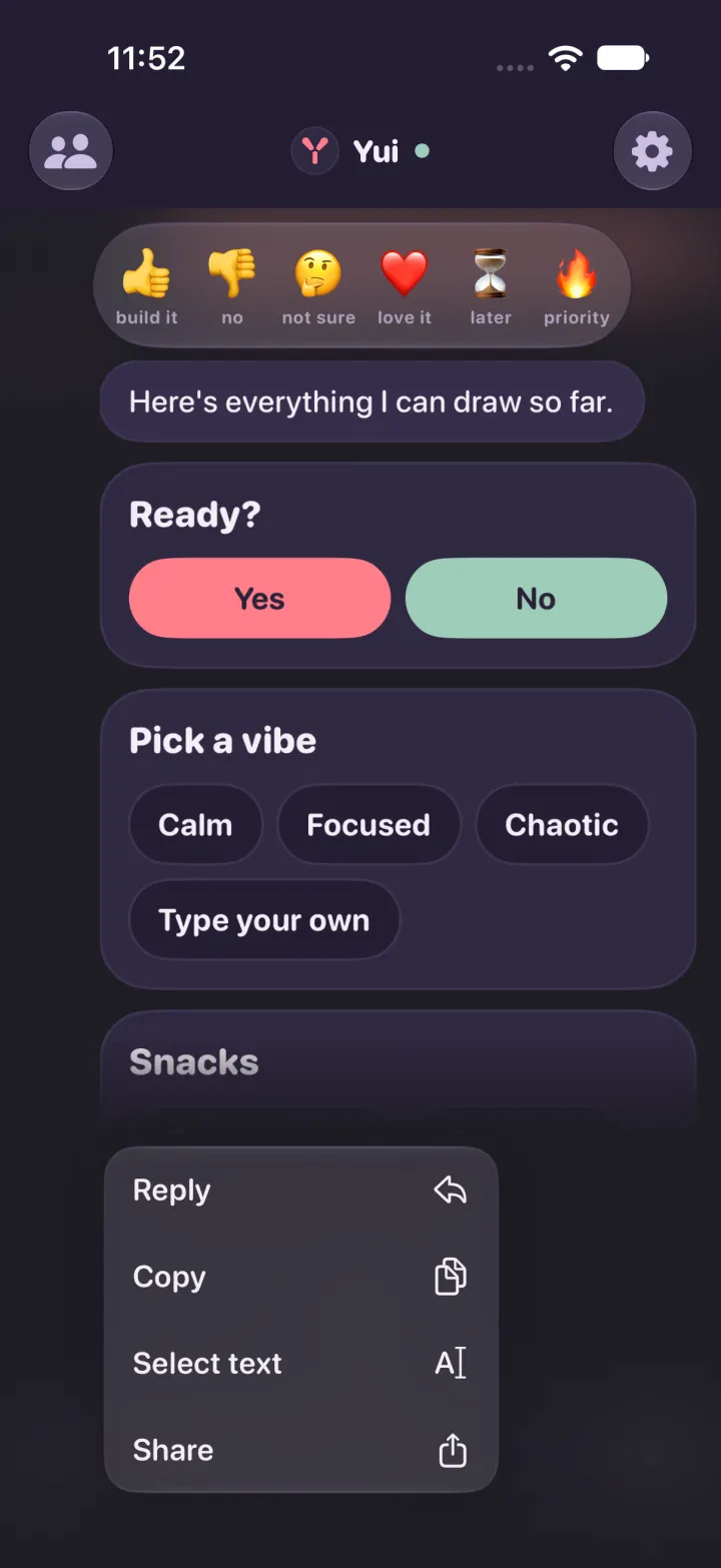 A tall card held in dark mode: reactions above, the top of the card fading out, the menu below.