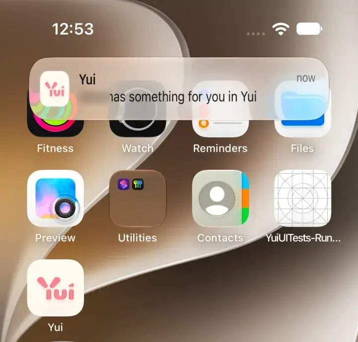 A notification on the home screen from Yui: an agent has something for you in Yui. The agent's name is blurred.